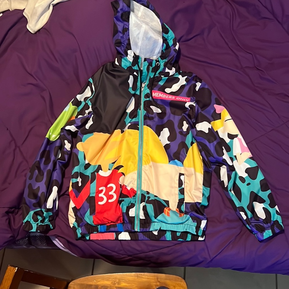 Windbreaker zip up jacket with draw string hood.